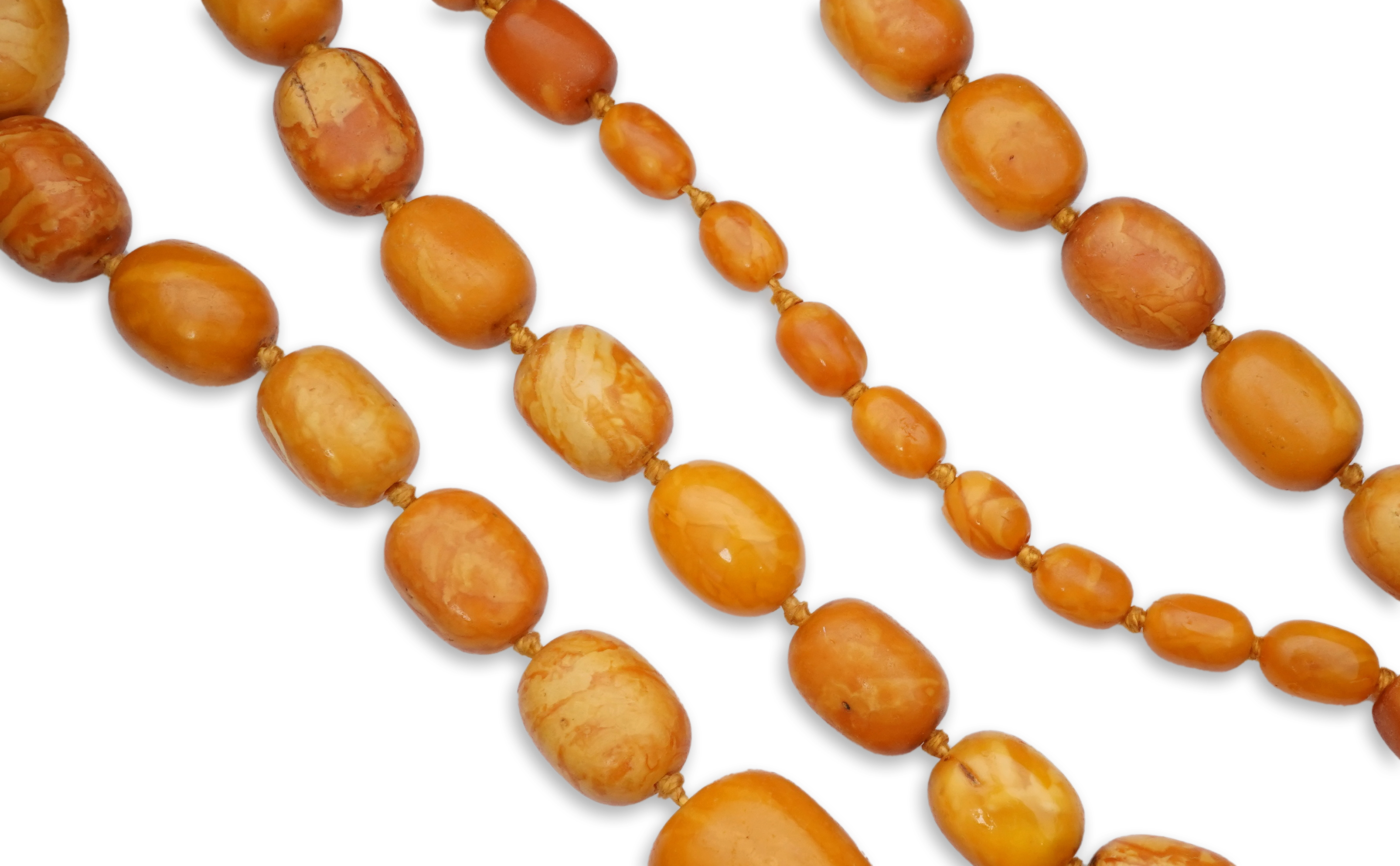 A single strand graduated oval amber bead necklace